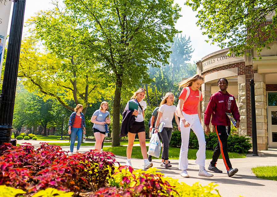 Students walking in front of Michels Commons on the SNC campus.