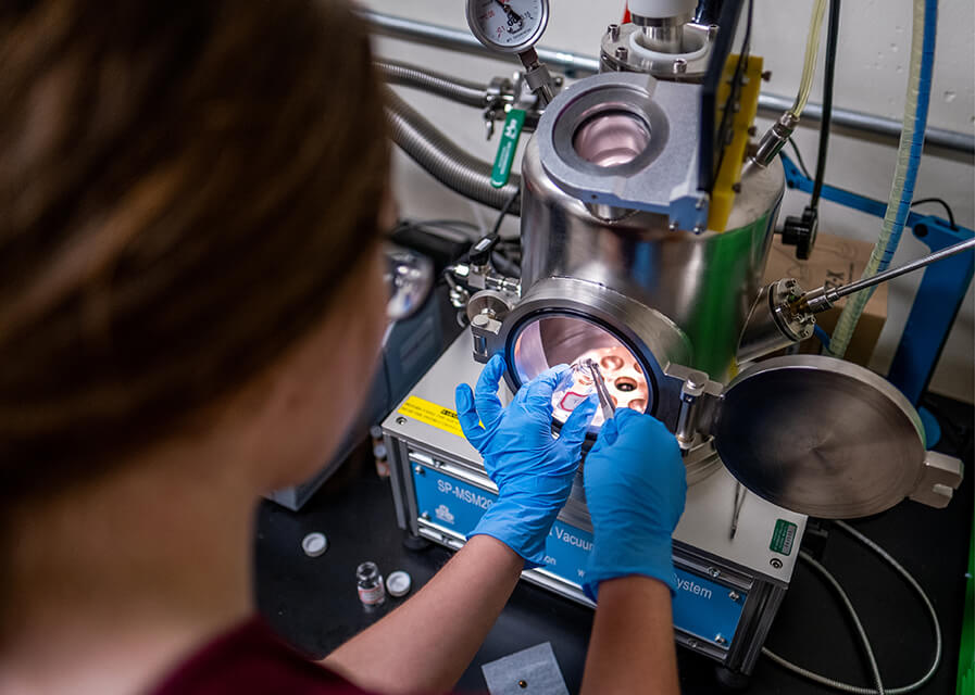 A student works on a project in a physics lab.