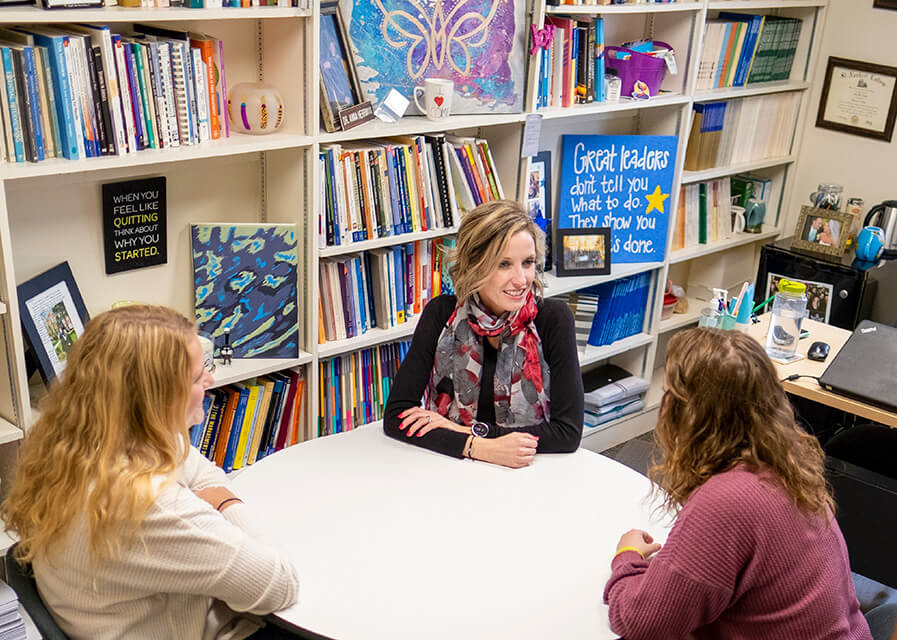 Students meeting with a professor