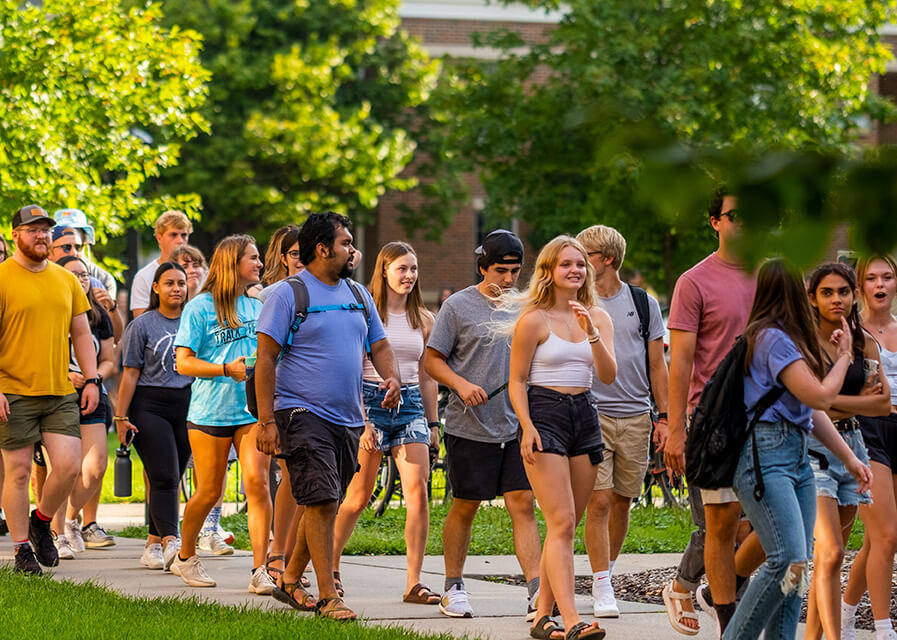 Students walk outside across the SNC campus.
