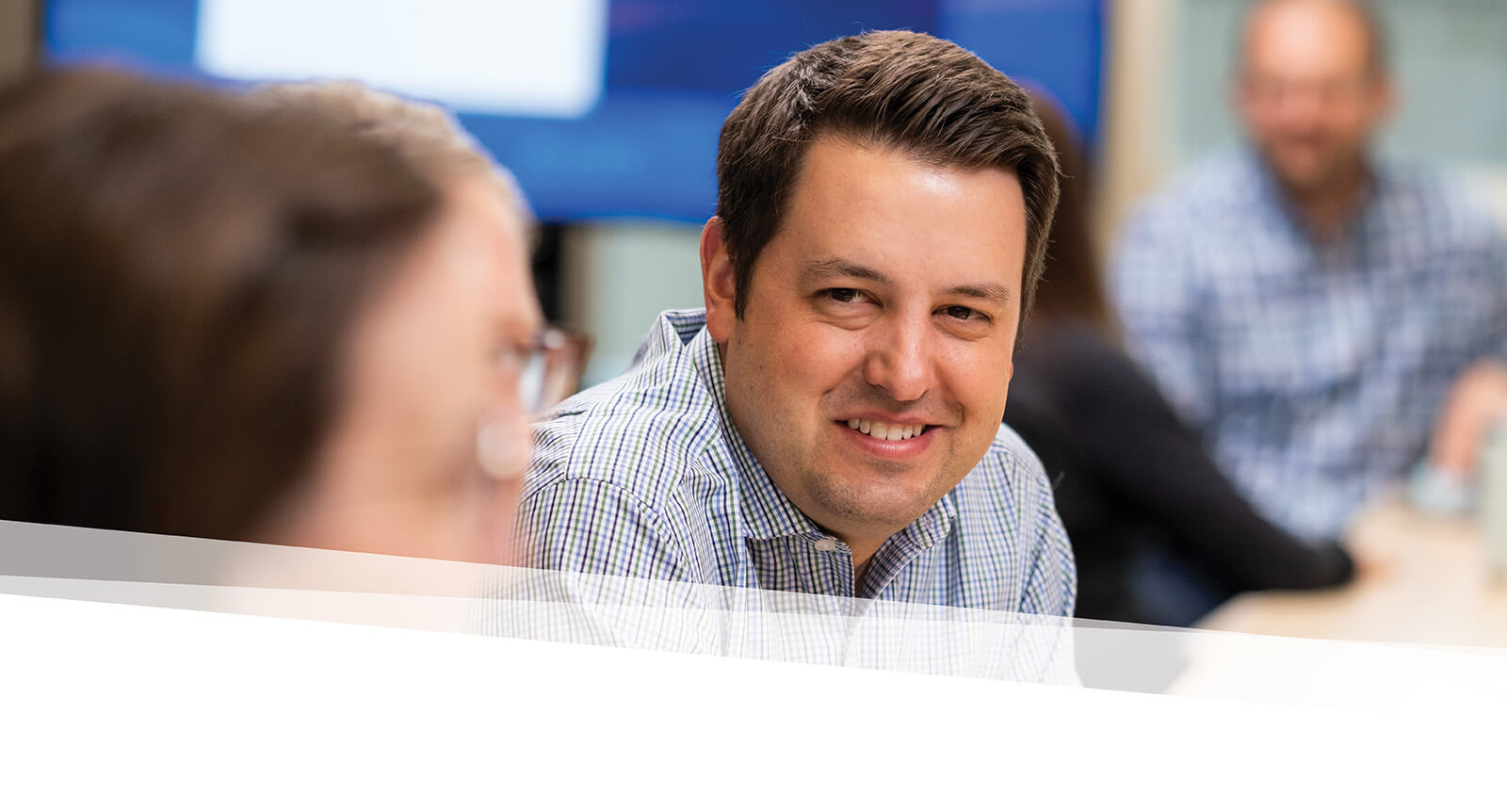 Admission staff in conversation with a student and their parent