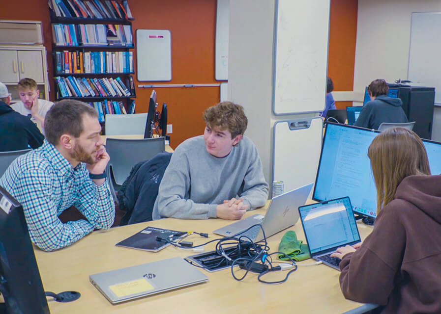 Students discuss a project in their computer science course at St. Norbert College.