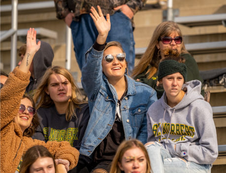 Waiving at SNC homecoming football game