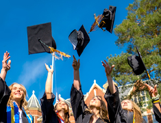 Commencement caps in the air