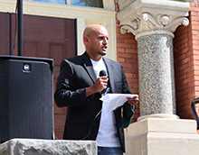 Corey speaking at silent protest