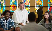 Rev. Michael Brennan with students