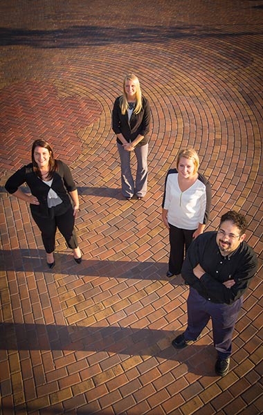 Finding their way on the HR path: left to right, Jenna Ray Hines ’13, Kaila Haen ’14 and Carley Milbrath ’14 with Matt Stollak (Business Administration).