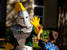 Norby high-fiving child