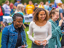 Smiling students at the involvement fair