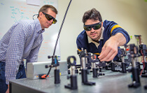 Students working with lasers in a lab