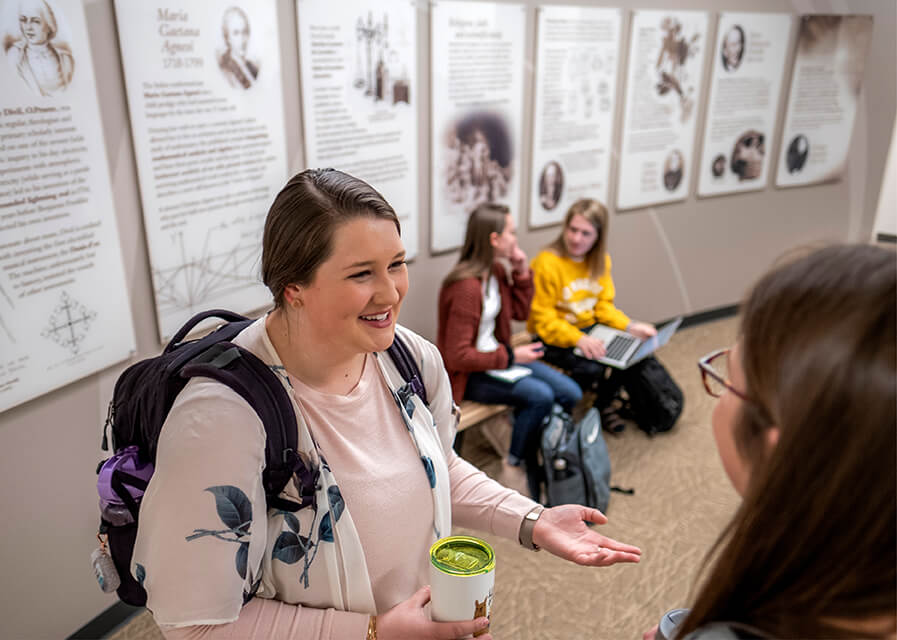 Students talk to one another in the hallway of the Gehl-Mulva Science Center.