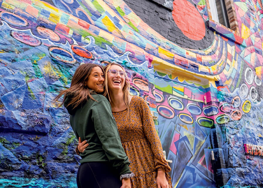 Students posed in front of community center